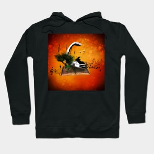 A piano is flying out of a book. Hoodie